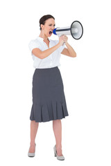 Furious businesswoman shouting in her megaphone