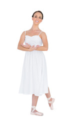 Cheerful young ballet dancer posing with leg back © lightwavemedia