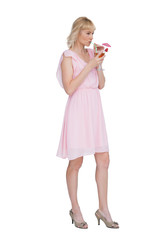 Sexy blonde posing while drinking cocktail and looking away