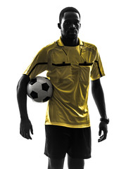 Fototapeta na wymiar one african man referee standing holding football silhouette