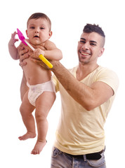 Young father lifting magic baby