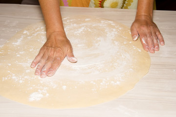 Hands kneading a dough