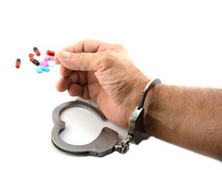 Handcuffed Man Holding Medicine