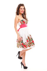 Fashion young woman in summer dress on white