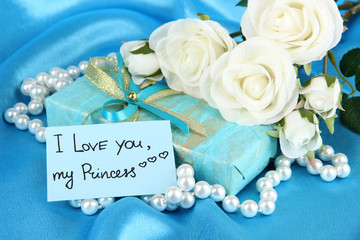 Romantic parcel on blue cloth background