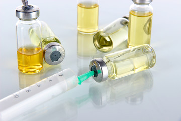 Obraz na płótnie Canvas Medical bottles and syringes isolated on white