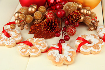 Fototapeta na wymiar Christmas cookies and decorations on color wooden background