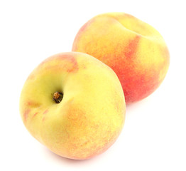 Ripe sweet peaches, isolated on white