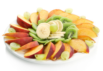 Assortment of sliced fruits on plate, isolated on white