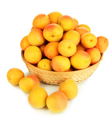 Fresh natural apricot in wicker basket isolated on white