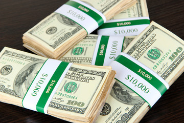 Stacks of money on wooden table