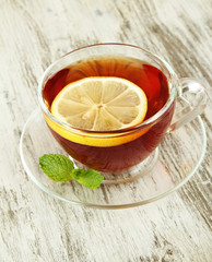 Cup of tea with lemon on table close-up