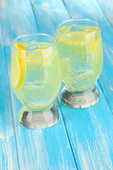 Delicious lemonade on table close-up