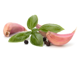 Garlic clove and basil leaf