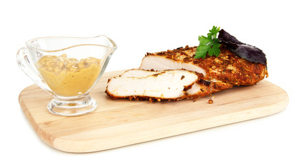 Roasted chicken fillets on wooden board, isolated on white