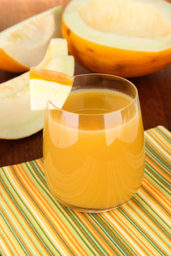 Delicious juice of melon on table close-up