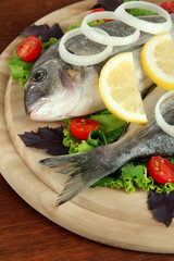 Fototapeta na wymiar Dorado fish on table close-up