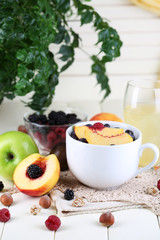 Oatmeal in cup with berries