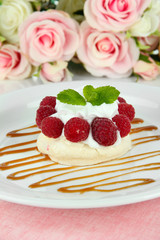 Tasty meringue cake with berries, close up