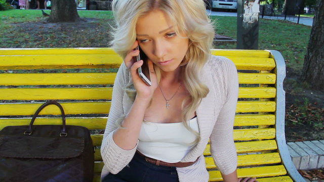 Beautiful woman calling on phone in park no answer girl