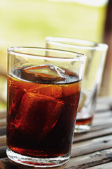 Glass of cola with ice cubes