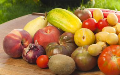 Healthy fruits and vegetables on table