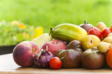Healthy fruits and vegetables on table