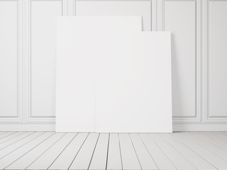 white decorative wall with blank posters