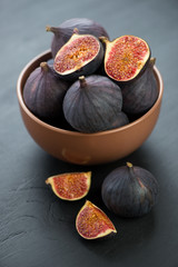 Ceramic bowl with ripe figs, vertical shot