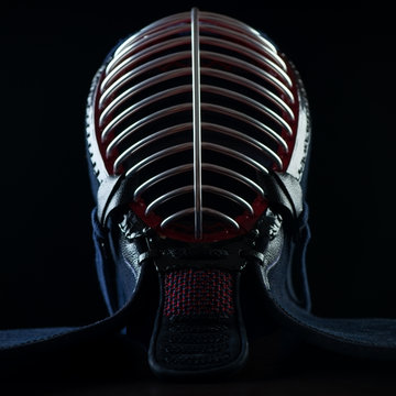 Men, front view over black background, studio shot