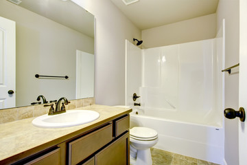 New home bathroom with shower and bath.