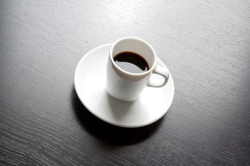 white cup with black coffee