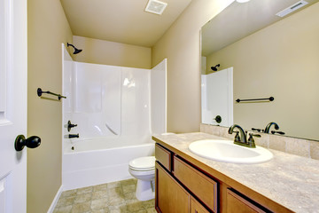 New home bathroom with shower and bath.