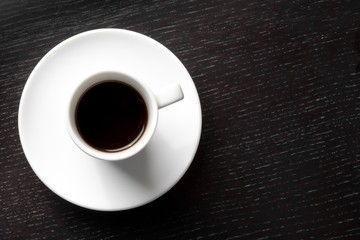white cup with black coffee with space for text