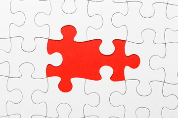 Incomplete puzzle with missing piece