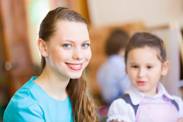Obraz premium Cute girl and teacher
