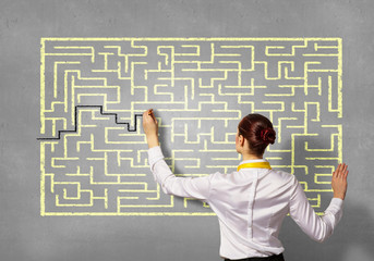 Businesswoman solving maze problem