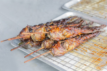 Stacked grilled catfish.