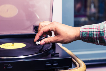 Hand operating needle on turntable