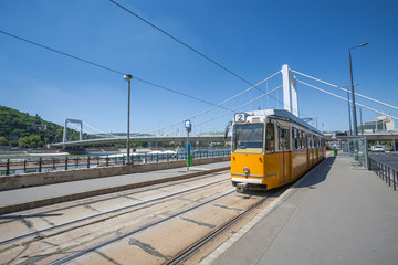 Yellow tram on the river bank of Danube in Budapest