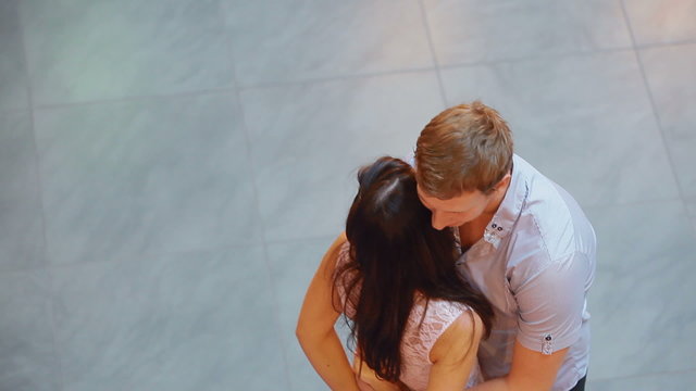 loving couple embracing standing in the room