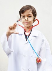 Little boy pretending to be a doctor