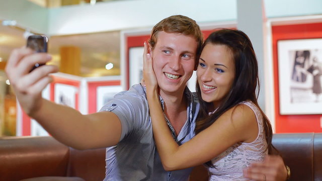 loving couple is photographed by a camera phone