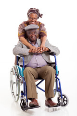 loving african wife hugging disabled husband
