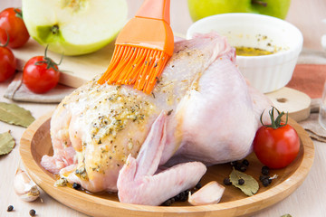 Small raw chicken stuffed with green apples spread brush sauce w
