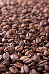 brown background from coffee grains close up