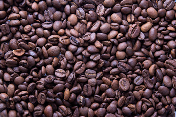 brown roasted coffee beans, background texture, close-up