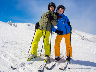 Fototapeta na wymiar Teenage girl and boy skiing
