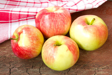 ripe apples on a wooden background
