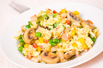 scrambled eggs with mushrooms and vegetables